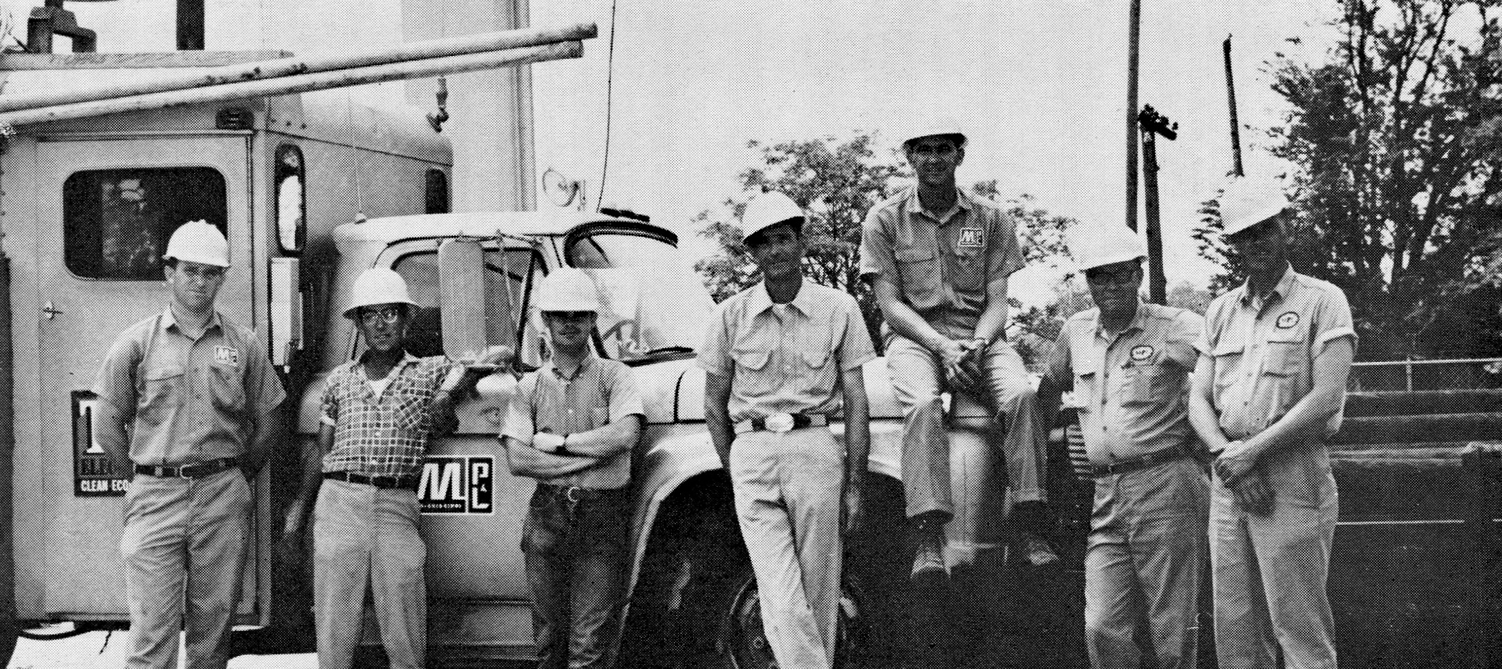 The members of this 1970 Indianola crew demonstrate a strong commitment to safety by all wearing hard hats, which were adopted as essential gear for line workers in 1961.